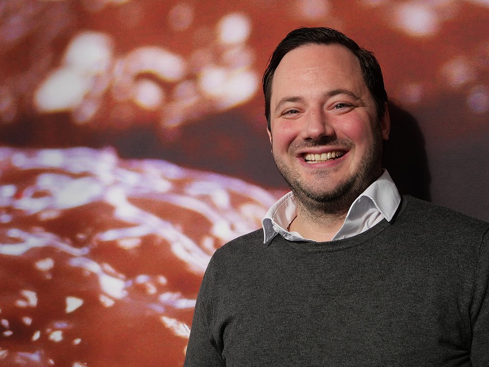 Porträt von Benjamin Rau, lachend