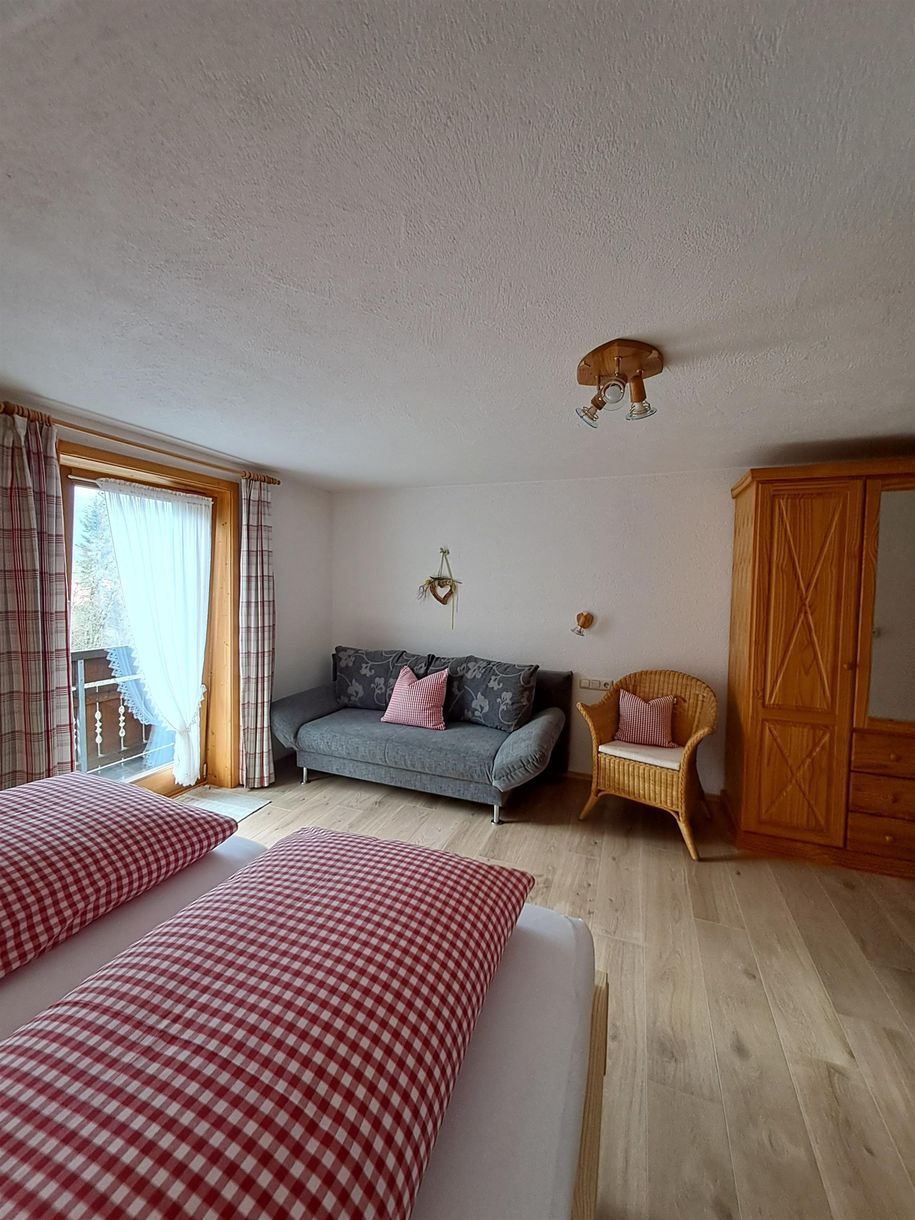 Schlafzimmer mit einer weiteren Schlafmöglichkeit