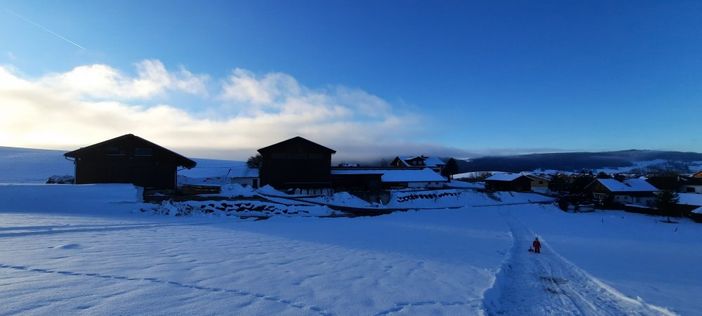 Rodelbahn mit Blick auf unseren Bauernhof