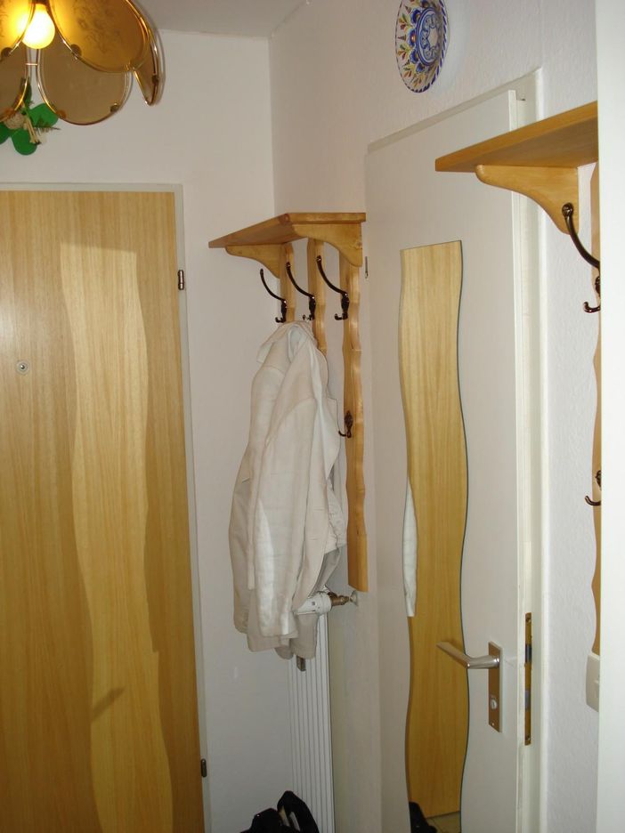 Eingangsbereich mit Gardrobe und Küchenzeile