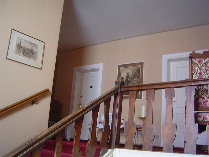 Treppenaufgang zu den Gästezimmern